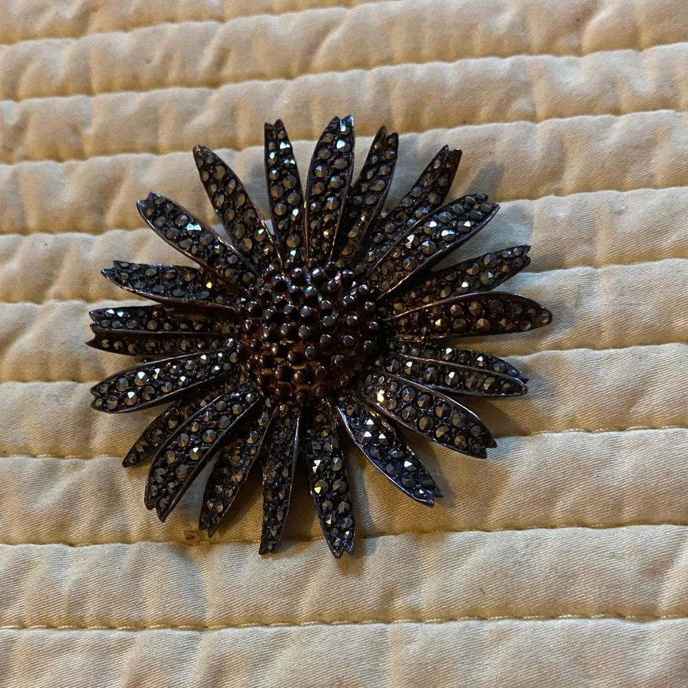 Antique sterling silver marcasite sunflower brooch.